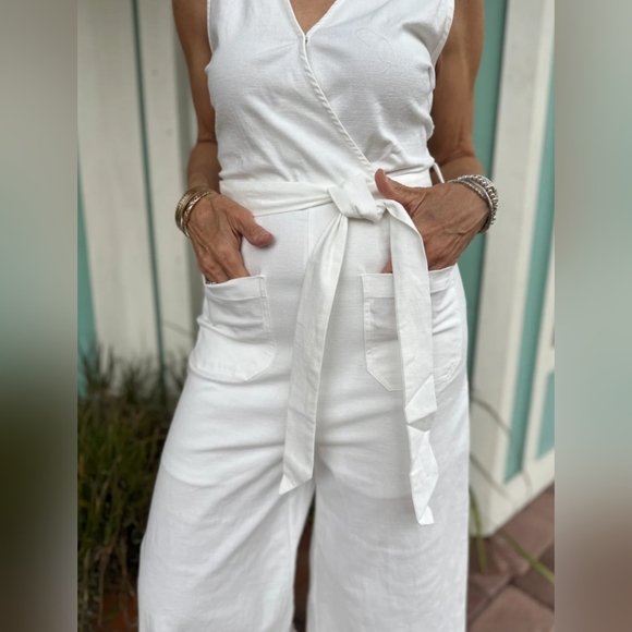 Elegant White Sleeveless Faux Wrap Wide Leg Jumpsuit - Picture 2 of 9
